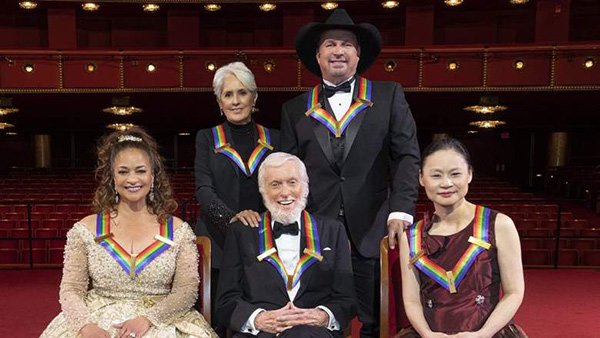 Garth Brooks and other Kennedy Center and other winners at the Kennedy Center wearing rainbow ribbons